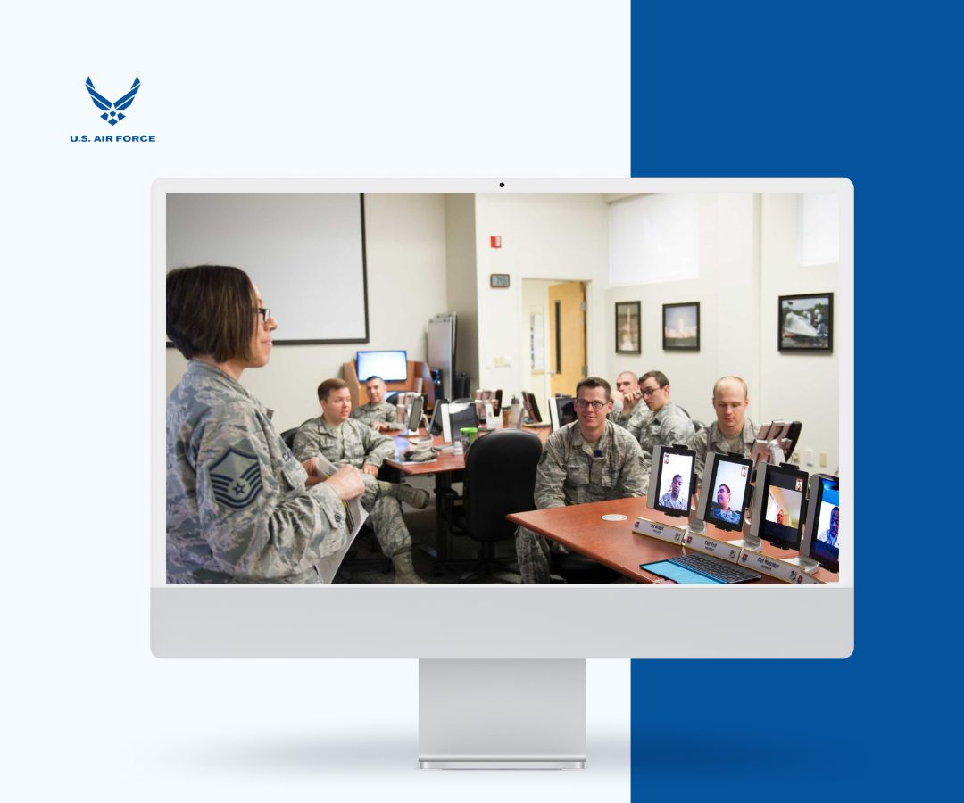 portfolio (20) Portfolio featured image depicts a United States Air Force meeting, with personnel in uniform collaborating in person and via laptops showing remote participants.